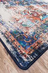 Achieve the best of both worlds with this striking area rug.  The saturated colors are softened under the intentionally distressed areas . Bring some instant impact into your décor with this sophisticated rug.