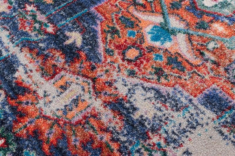 Achieve the best of both worlds with this striking area rug.  The saturated colors are softened under the intentionally distressed areas . Bring some instant impact into your décor with this sophisticated rug.